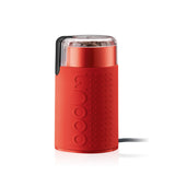 Red coffee grinder with Bodum branding on a white background