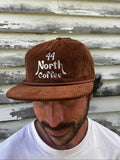 Brown corduroy 5-panel hat with nautical 44 North Coffee logo